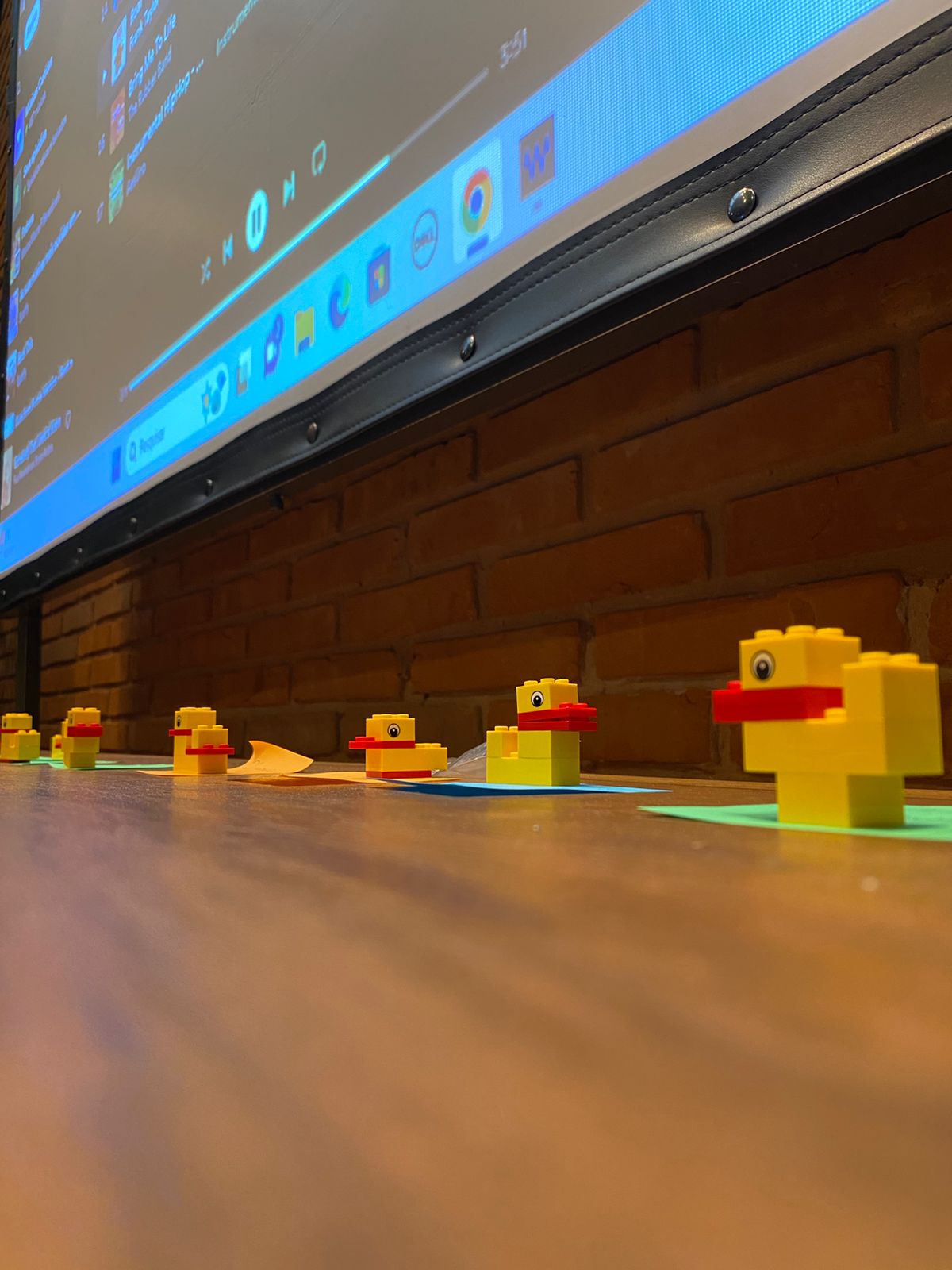 A live The Duck facilitation in progress — duck builds on the table, the room working behind